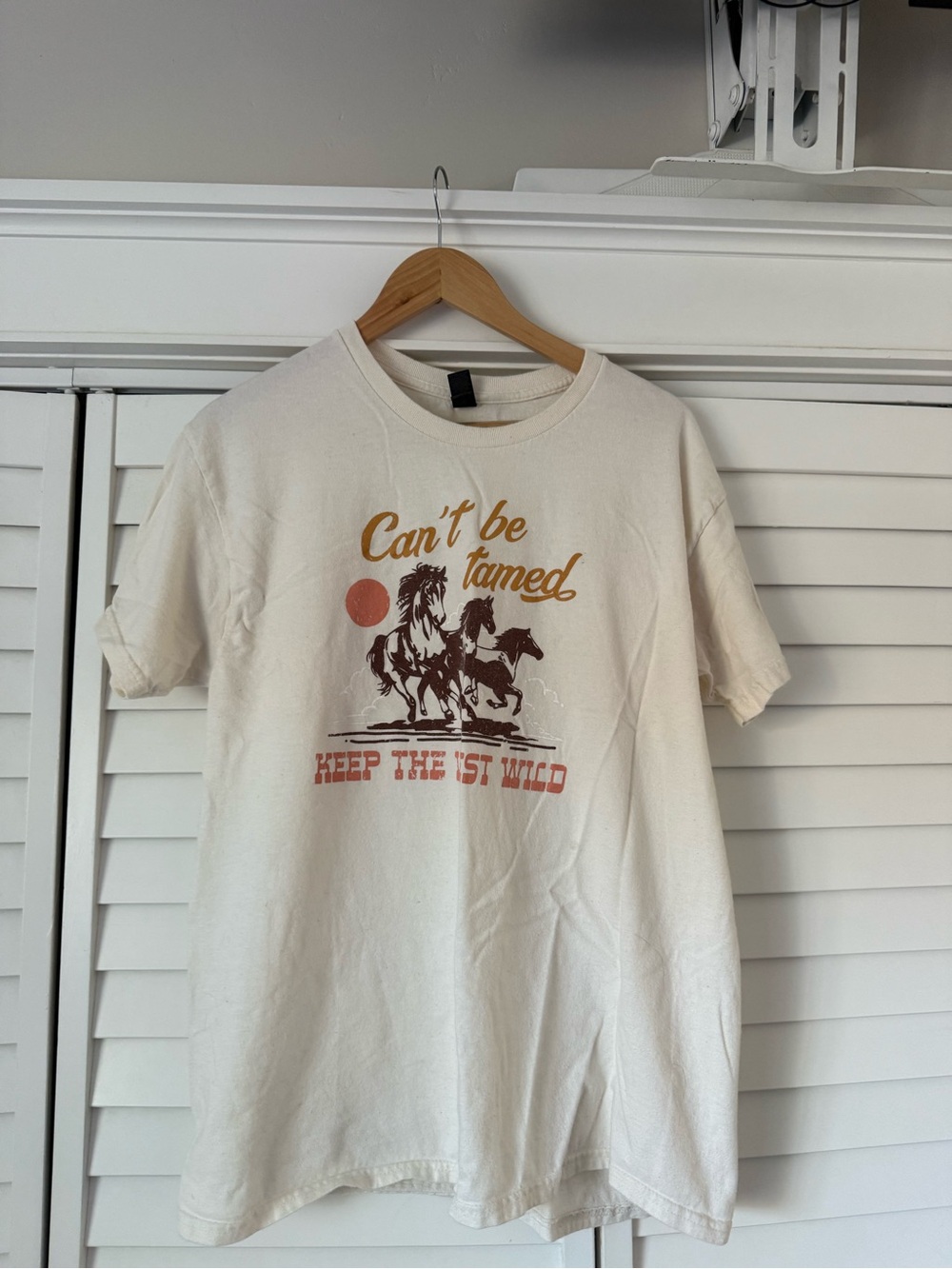 Gildan Cream 'Can't Be Tamed' Graphic Tee with Rust & Brown Print